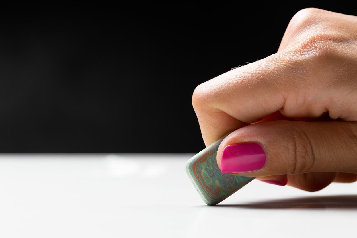 hand with eraser