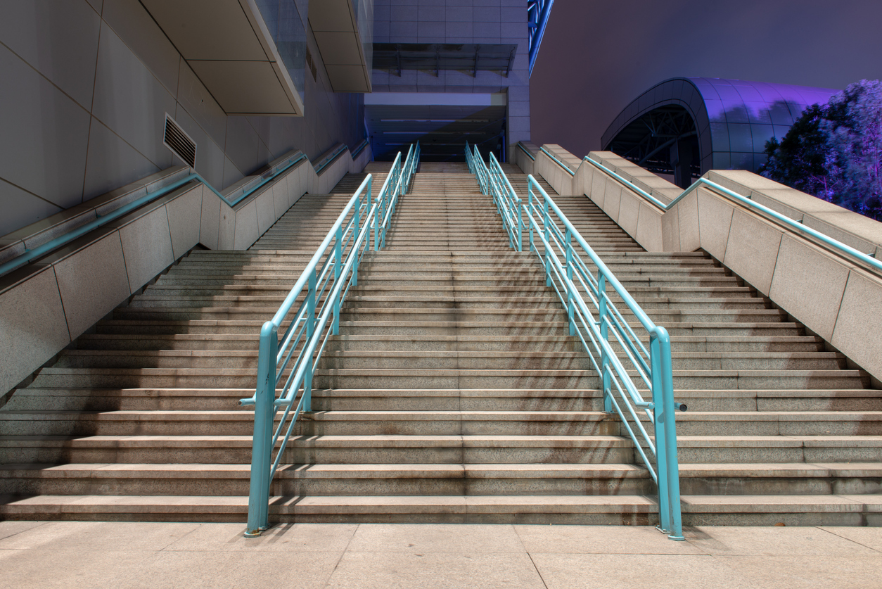 multiple paths of Old stone steps and stainless steel guardrail on the steps